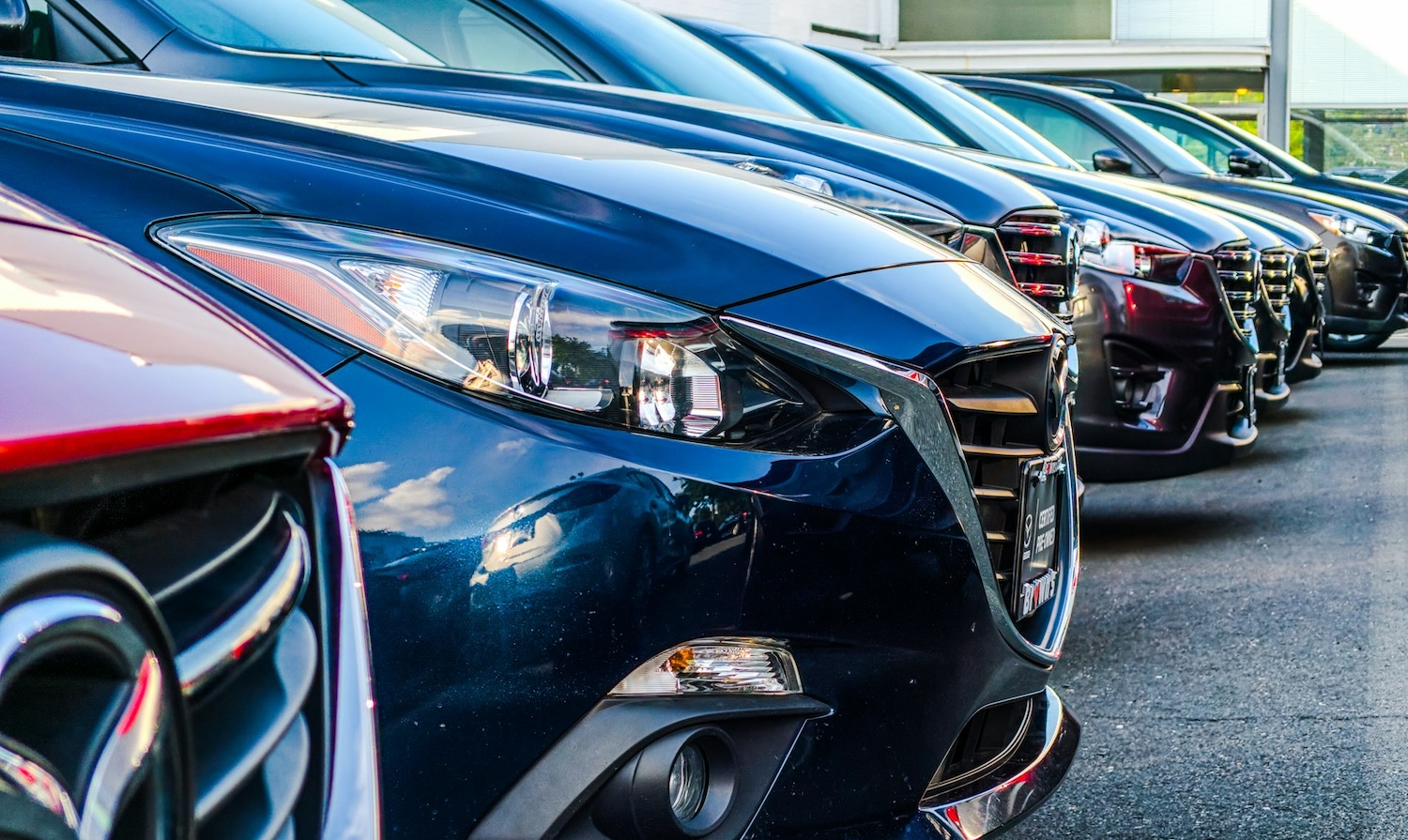 Commercial cars parked in a parking lot